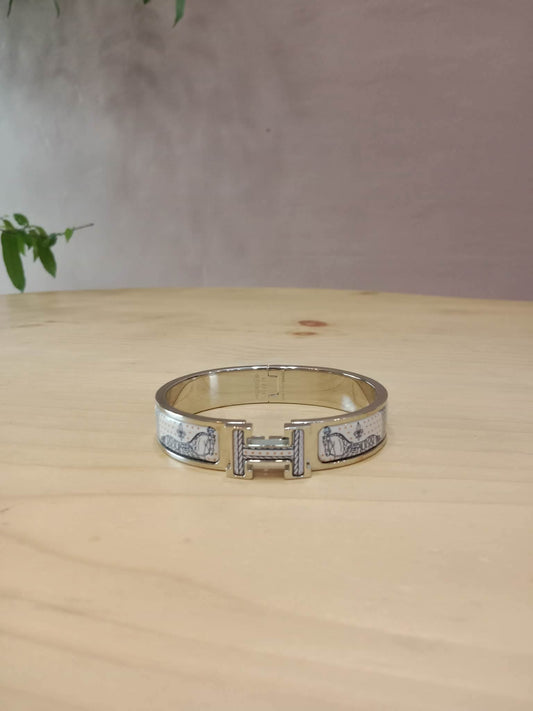 Hermes Clic H Bracelet in the "Grand Apparat Remix" Pattern White Enamel Printed Band Palladium-Plated Hardware GM Size