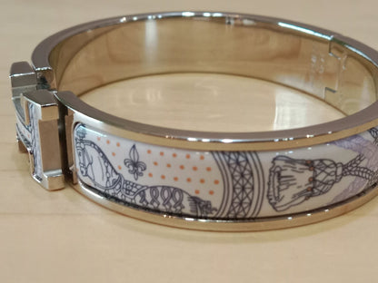 Hermes Clic H Bracelet in the "Grand Apparat Remix" Pattern White Enamel Printed Band Palladium-Plated Hardware GM Size