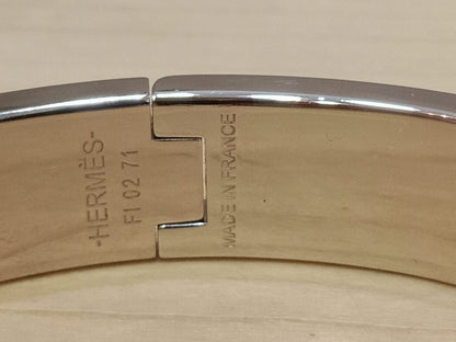 Hermes Clic H Bracelet in the "Grand Apparat Remix" Pattern White Enamel Printed Band Palladium-Plated Hardware GM Size