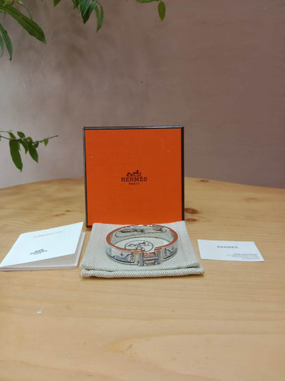 Hermes Clic H Bracelet in the "Grand Apparat Remix" Pattern White Enamel Printed Band Palladium-Plated Hardware GM Size