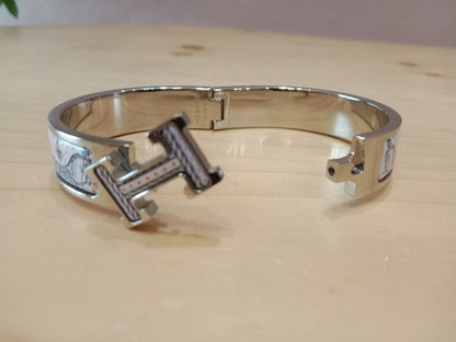 Hermes Clic H Bracelet in the "Grand Apparat Remix" Pattern White Enamel Printed Band Palladium-Plated Hardware GM Size